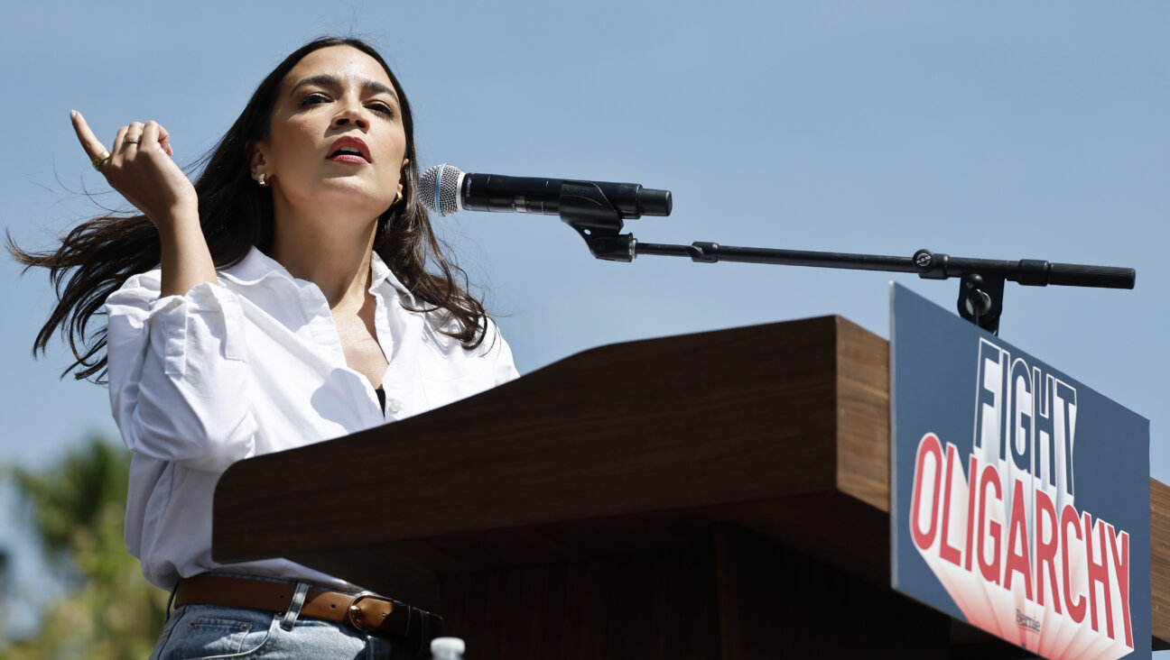 Rep. Alexandria Ocasio-Cortez speaks during a stop on the ‘Fighting Oligarchy’ tour with U.S. Sen. Bernie Sanders in Los Angeles on April 12.